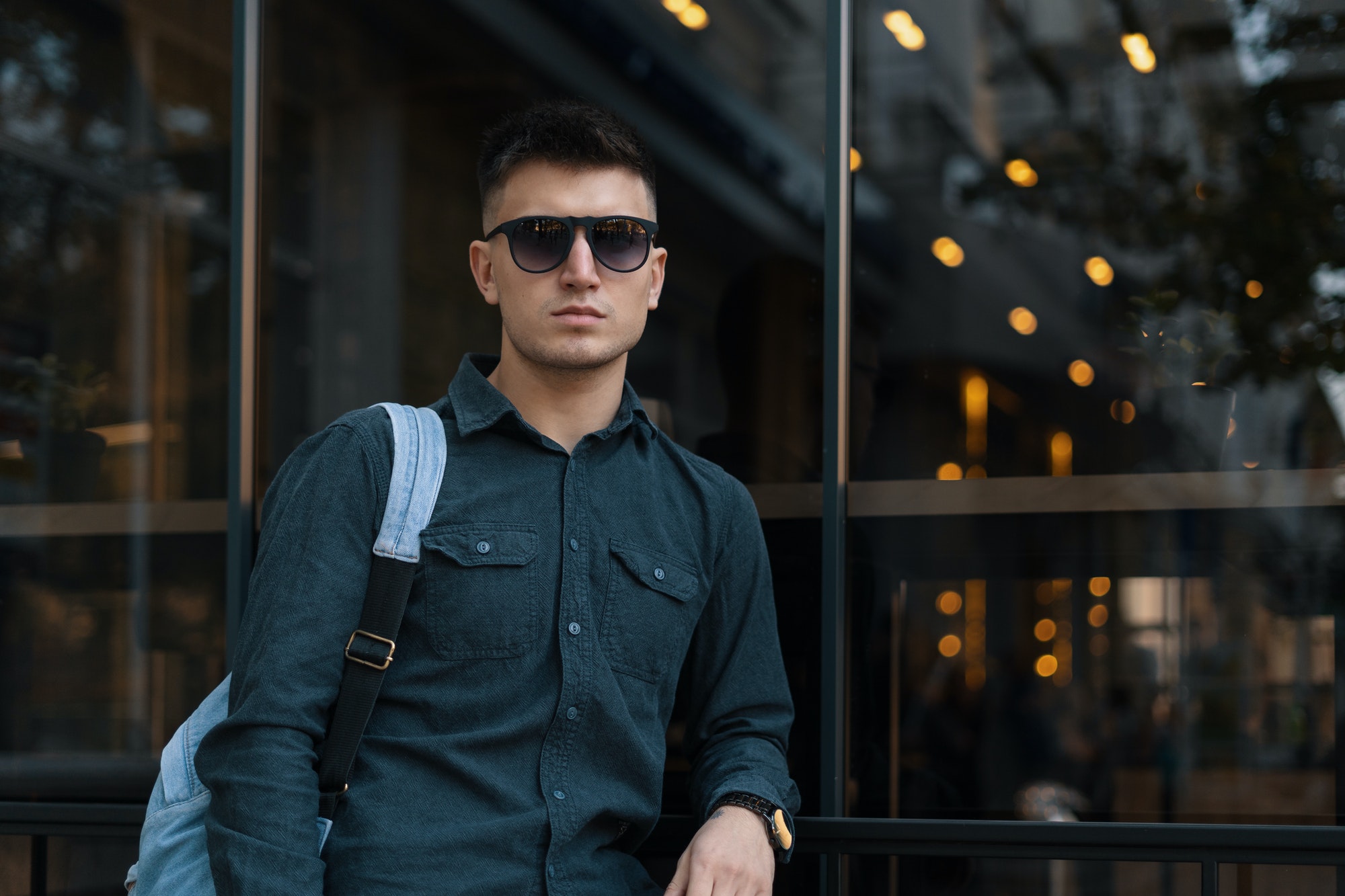 Modern young male with sunglasses and backpack